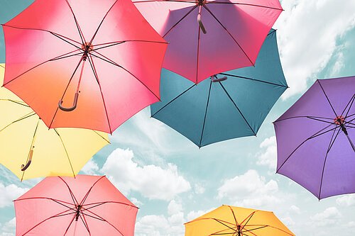 Colorful umbrellas background. Colorful umbrellas in the sky. St